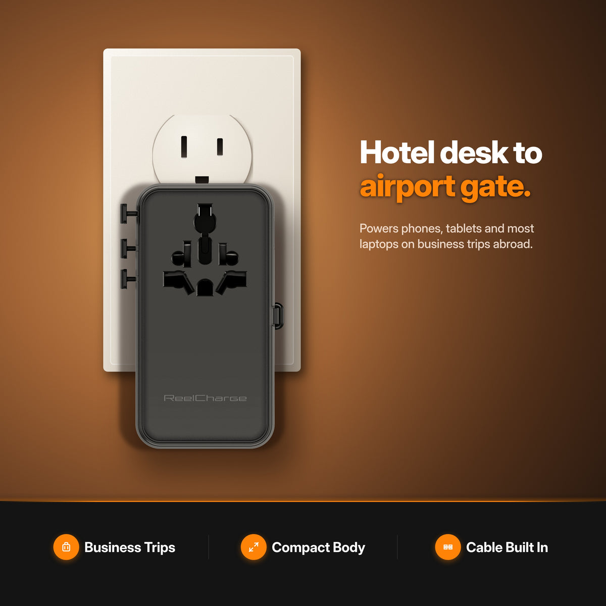 ReelCharge 100W Global Travel Charger plugged into a US wall outlet — hotel desk to airport gate