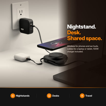 ReelCharge 3-in-1 Universal Wireless Charger 100W in Black: lifestyle scene charging a phone, earbuds and laptop on a desk