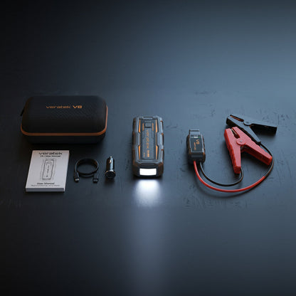Veratek V8 Vehicle Jump Starter kit laid out: jump starter, smart clamps, carry case, car charger, USB-C cable and user manual